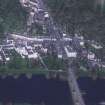 Oblique aerial view centred on the town of Dunkeld with road bridge adjacent, taken from the S.