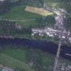 Oblique aerial view centred on the town of Dunkeld with road bridge and cathedral adjacent, taken from the SE.