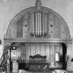 Furnishings, religious building fixtures and sound devices.  
Photographic view of interior showing organ case, pulpit and communion table.